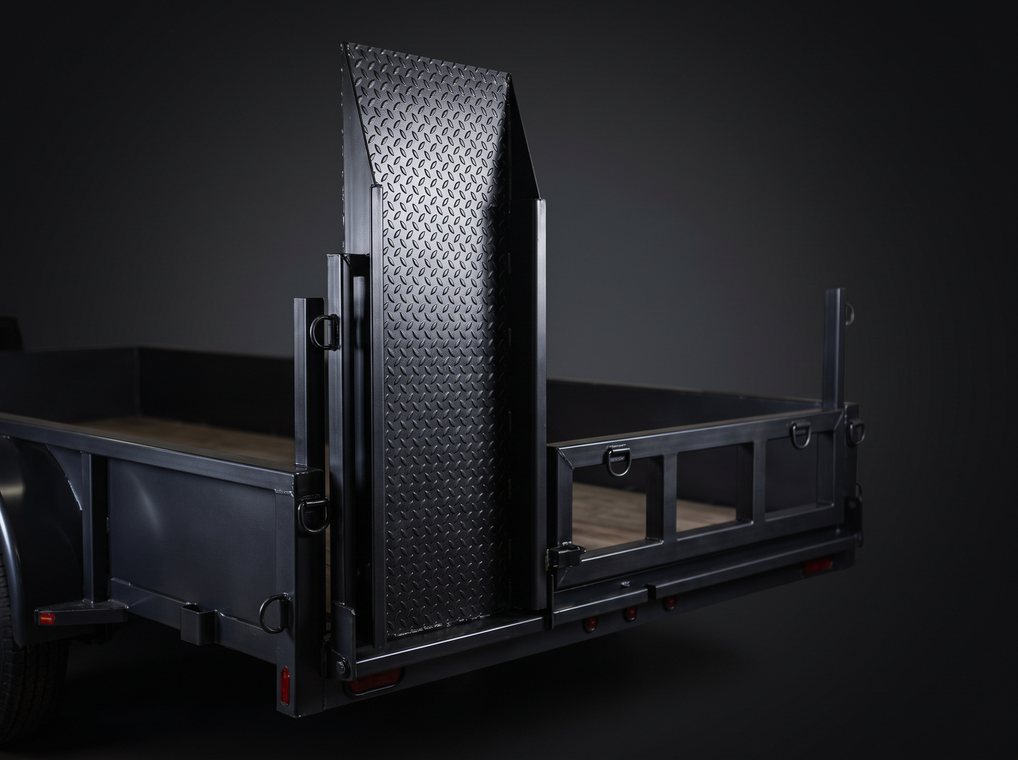 Push mower loading ramp and tie-down rack on a landscape trailer