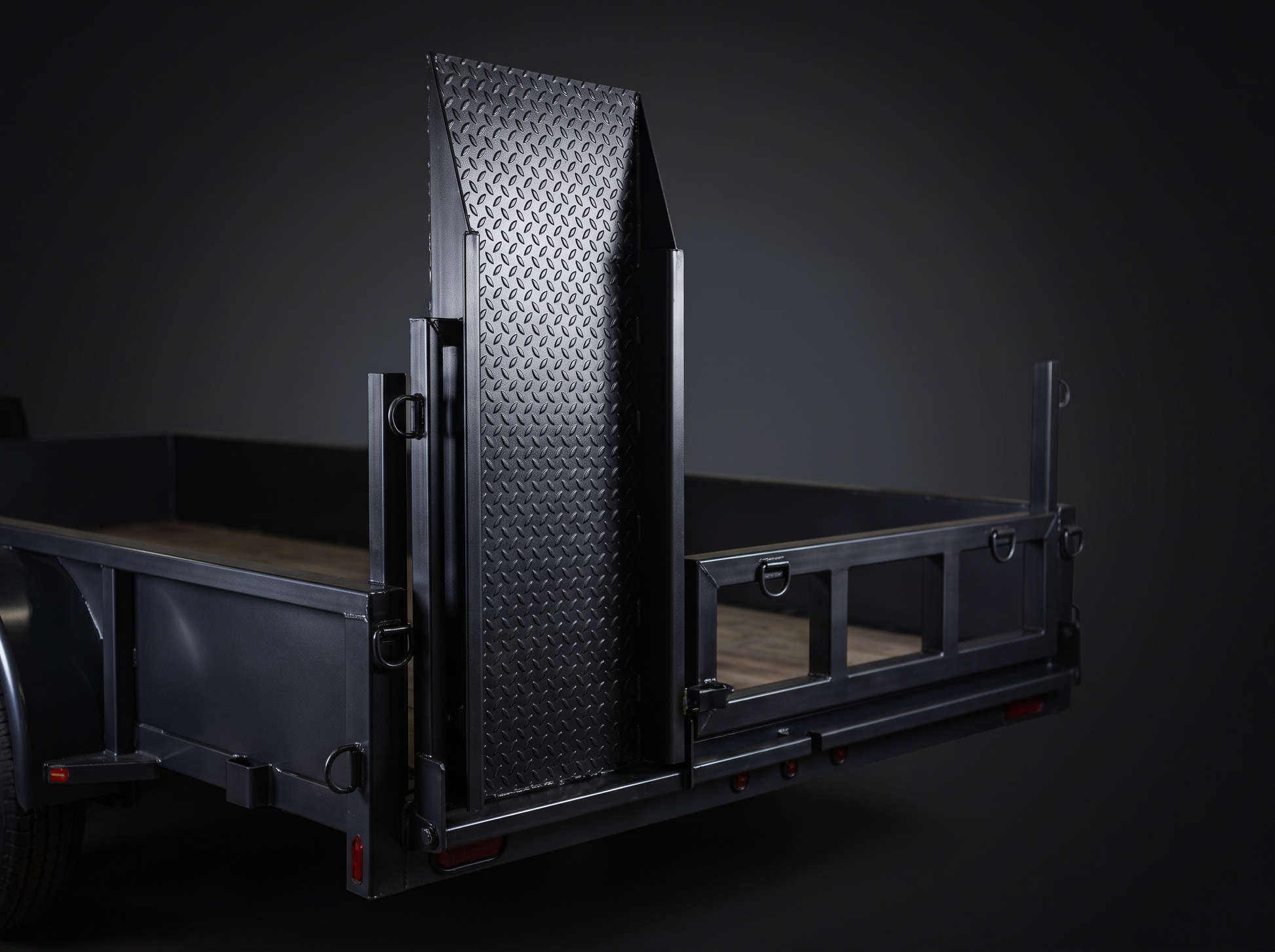 Push mower loading ramp and tie-down rack on a landscape trailer